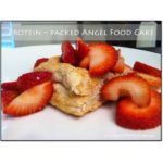 angel food cake with strawberries on a white plate