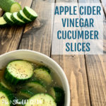 cucumber slices in a bowl with apple cider vinegar with sliced cucumbers in the background