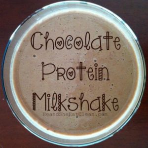 chocolate protein milkshake in a clear glass