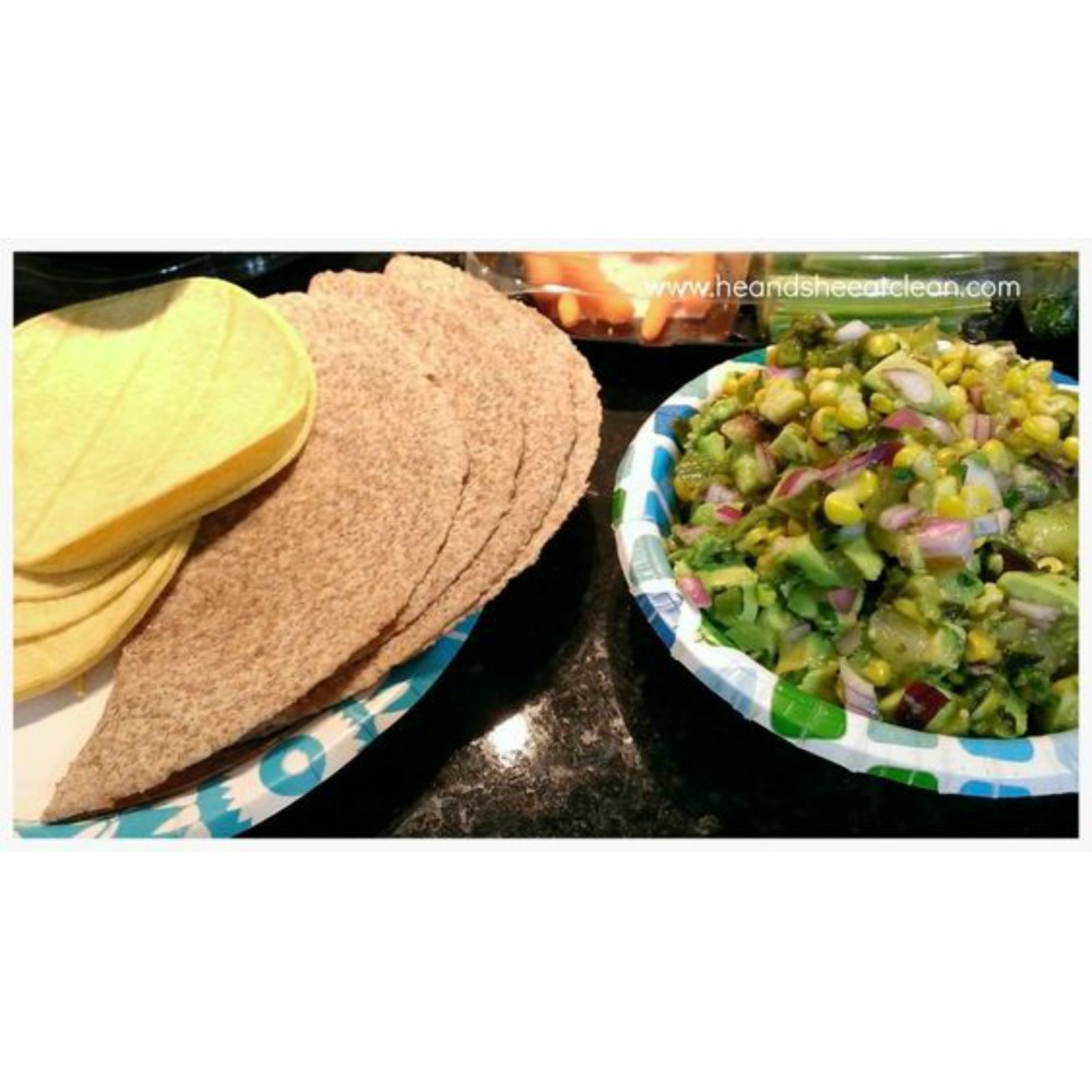 two paper plates, one with tortillas and one with guacamole