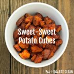 sweet potato cubes in a white bowl on a wooden table