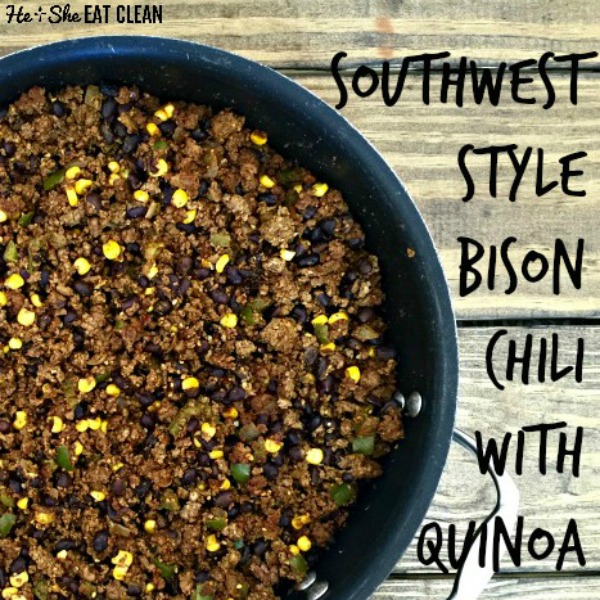 bison chili with corn in a black pot on a wooden table