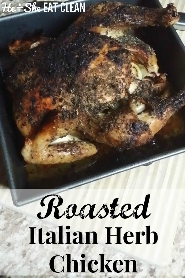 roasted chicken in a black pan on a beige table