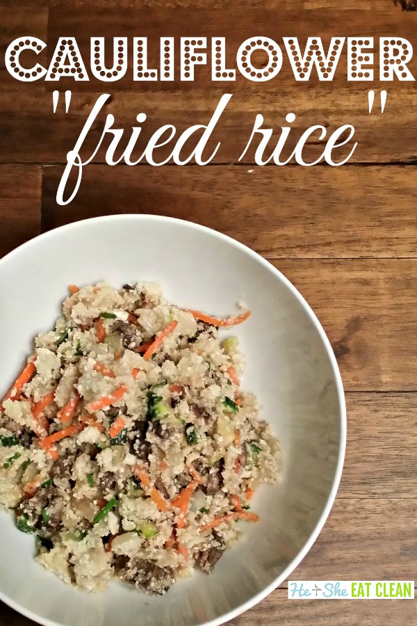 low carb cauliflower fried rice in a white bowl on a wooden table