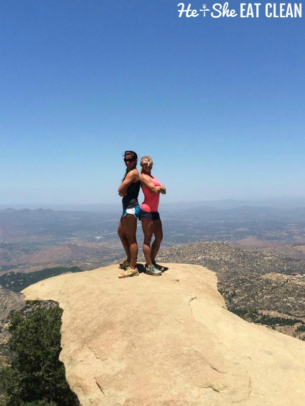 two females standing on a rock ledge at the potato chip hike in San Diego