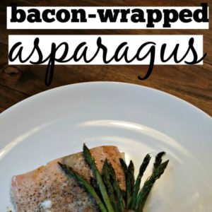 white plate with salmon and bacon wrapped asparagus square image