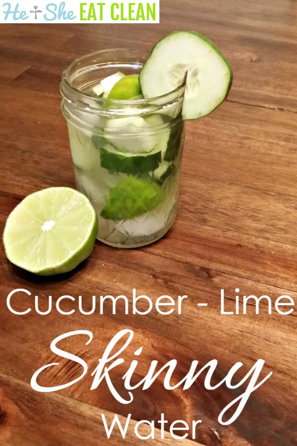 lime and cucumber in a water glass on a wooden table with text that reads cucumber lime skinny water