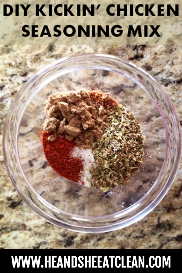 seasoning spices in a clear bowl with the text that reads make your own kickin' chicken seasoning mix