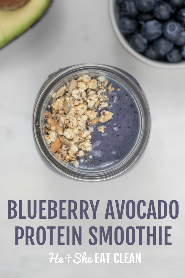 smoothie in a mason jar with granola on top with text that reads blueberry avocado protein smoothie
