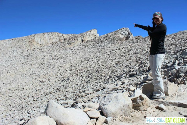 female pointing to the summit of Mount Whitney