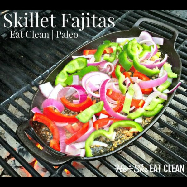 skillet fajitas with peppers and onions on top on a grill