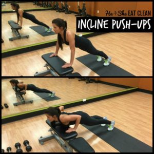 female doing incline push-ups on a bench