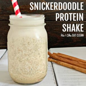 protein shake in a glass jar with a white and red straw with cinnamon sticks, text reads Snickerdoodle Protein Shake