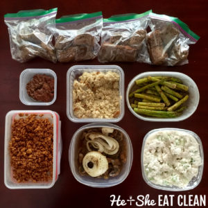 overhead shot of clean eating food prep: protein bars, chicken, burgers, asparagus, chicken salad