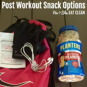 gym bag, headphones, planters peanuts, workout gloves on a wooden table