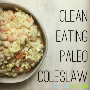 paleo coleslaw in a white bowl on a white slab with text that reads clean eating paleo coleslaw