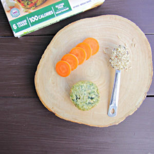 overhead shot of a Garden Lites Vegetable Muffin with sliced carrots and a tablespoon of rice
