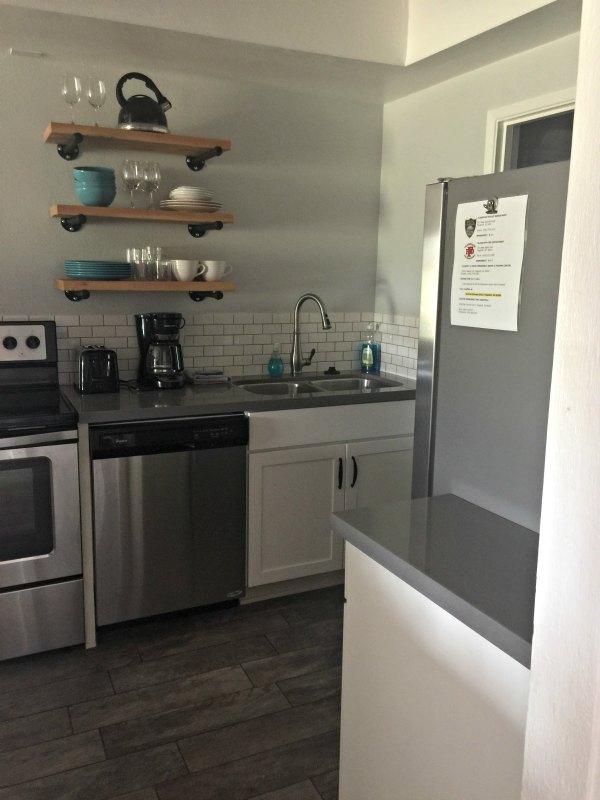kitchen with gray walls and white cabinets