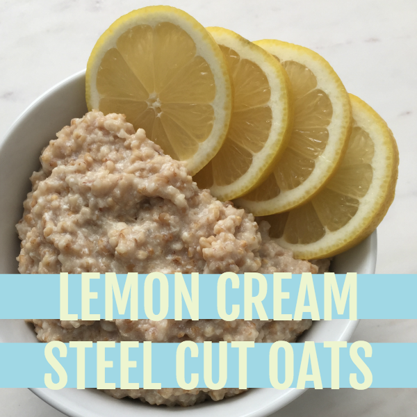 cooked oats in a white bowl with lemon slices lining the bowl all on a white marble slab with text that reads lemon cream steel cut oats