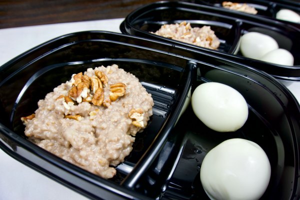 3 meal prep containers with eggs and oats
