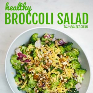 broccoli salad topped with cheddar cheese and pecans in a white bowl on a white marble top square image