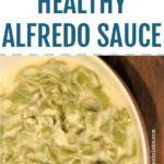 bowl of creamy alfredo sauce on a wooden table with text that reads healthy alfredo sauce, low carb and low calorie