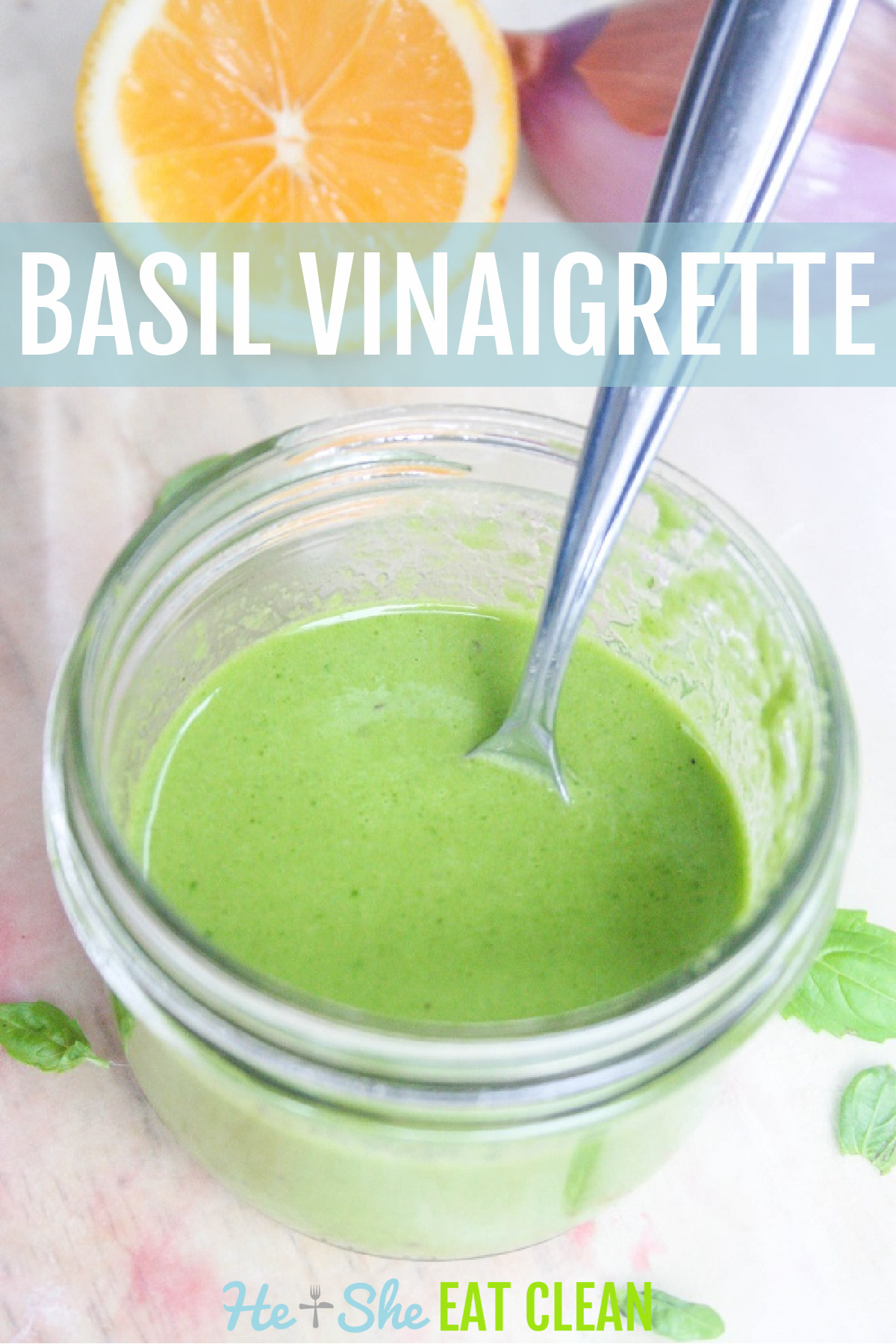 Basil Vinaigrette Dressing in a glass jar with a silver spoon