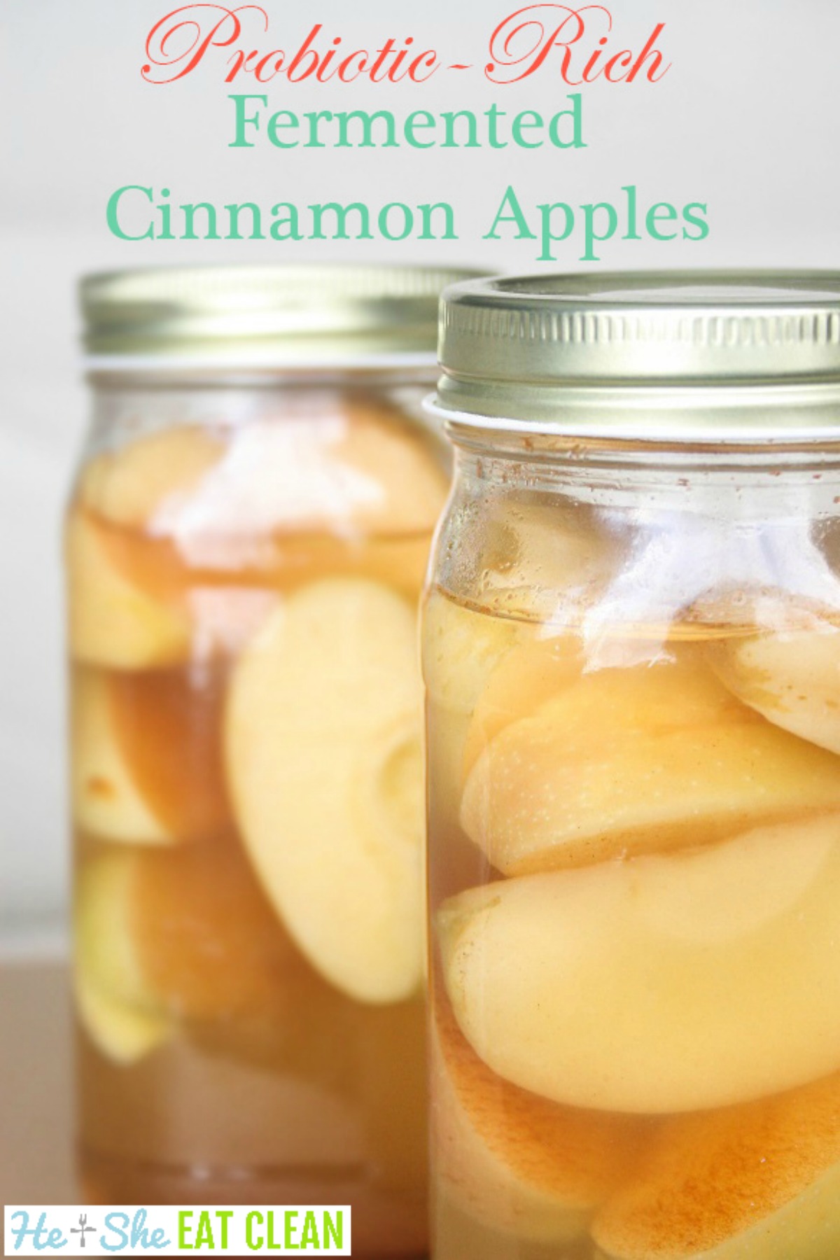 sliced apples fermenting in a clear jar
