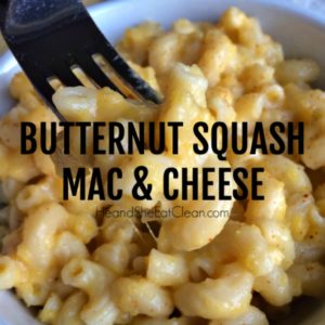 white bowl with fork full of elbow pasta with butternut squash mac & cheese