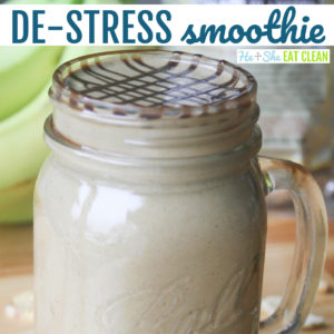 smoothie in a glass major jar with bananas in the background text reads de-stress smoothie